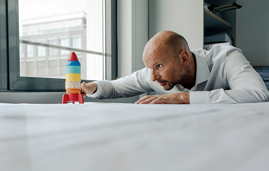 Man looking at a rocket