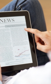 man reading news