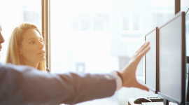 people pointing at screen