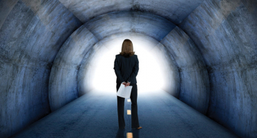 Businesswoman standing in a tunnel