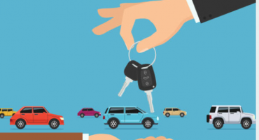 Car keys with cars in background