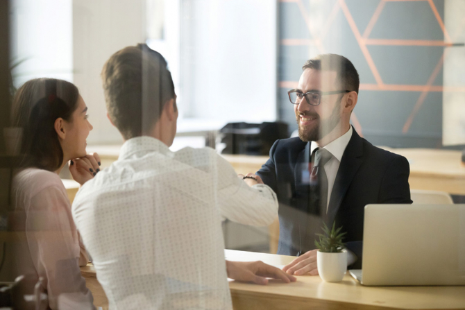 people sitting in front of a consultant
