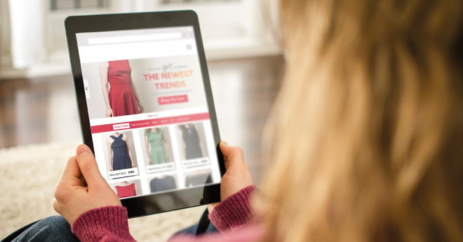 Woman doing online shopping on a tablet