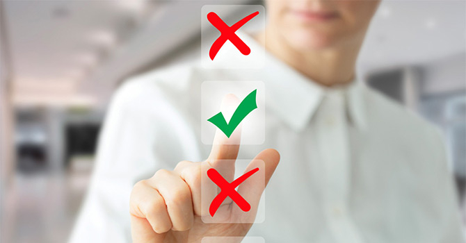 Person pointing on check mark