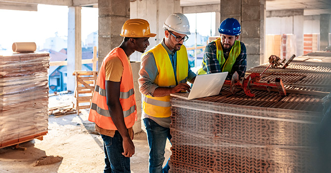 three man on building site