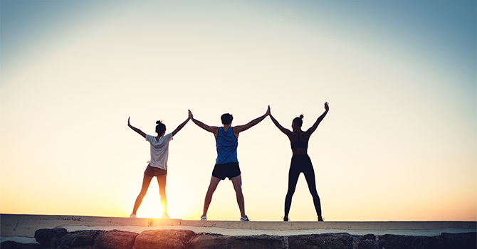 team of three holding hands