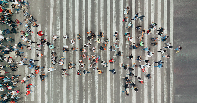 Arrow made of people standing