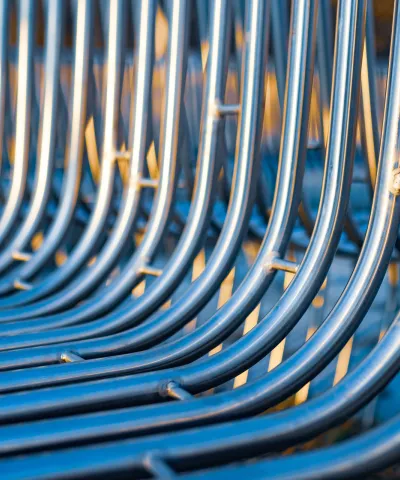 Image of metal barriers curving upwards as a metaphor for sales incentive plans