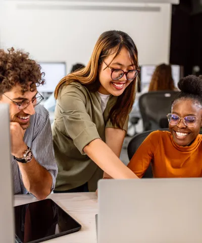 employees looking at laptop