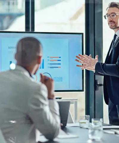 man talking at the meeting in front of the people