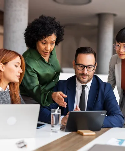 employees discussing profitability strategy