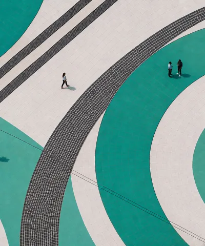 people standing on teal swirls