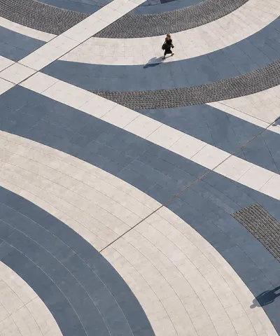 people standing on grey swirls 