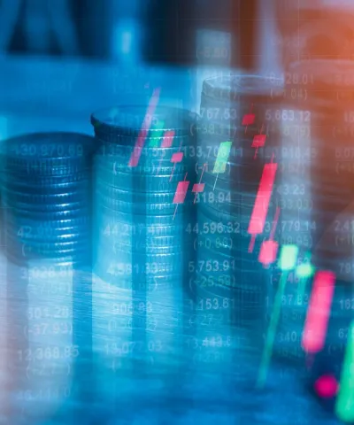 profit graph with stacked coins in the background