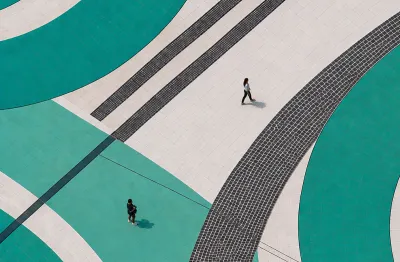 people on top of teal swirls