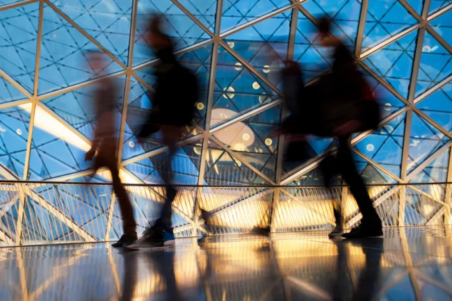 Blurred silhouettes of Professionals walking