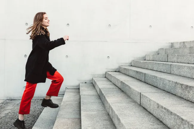 woman going up the stairs