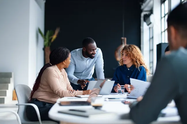 employees discussing sales plans