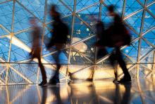 Blurred silhouettes of Professionals walking