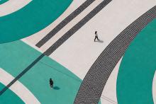 people on top of teal swirls