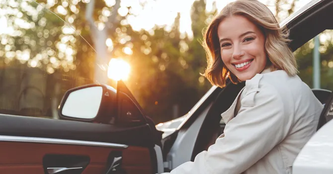 girl in car laughing
