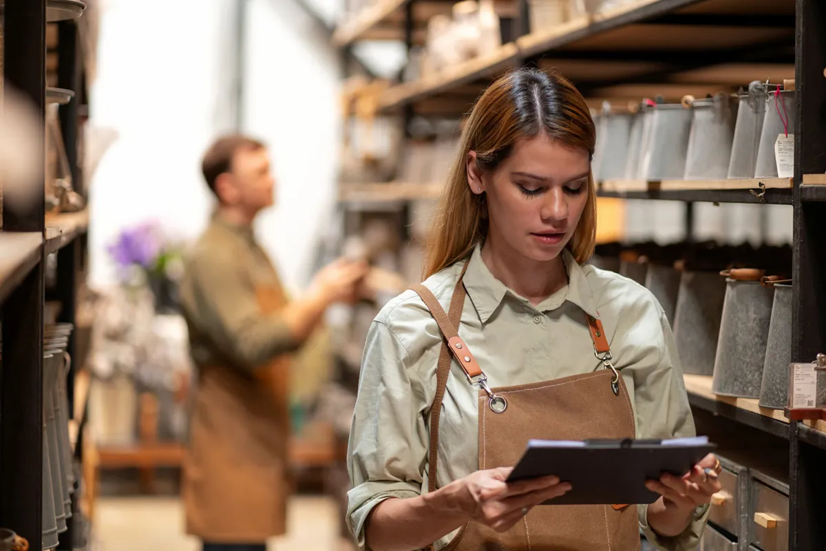 woman holding a tablet in warehouse