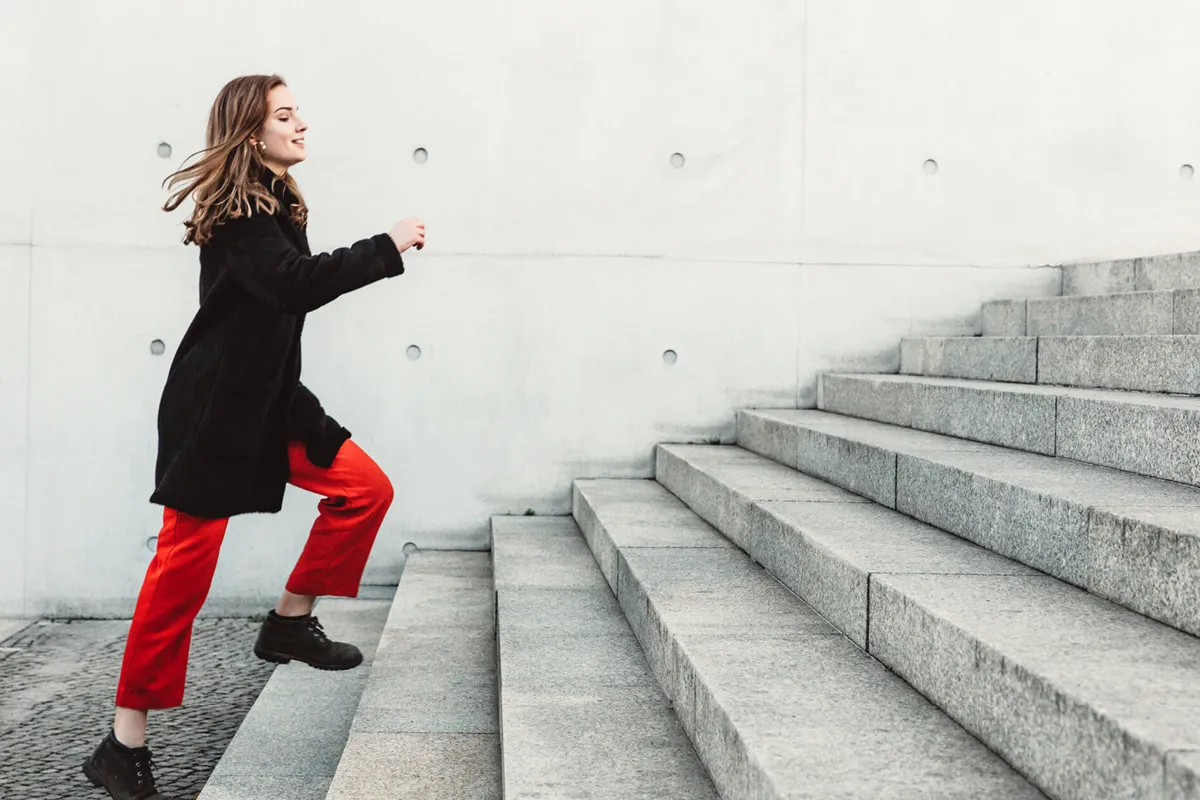 woman going up the stairs