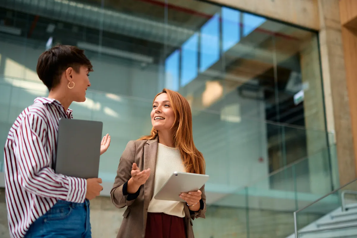 two women talking in the office