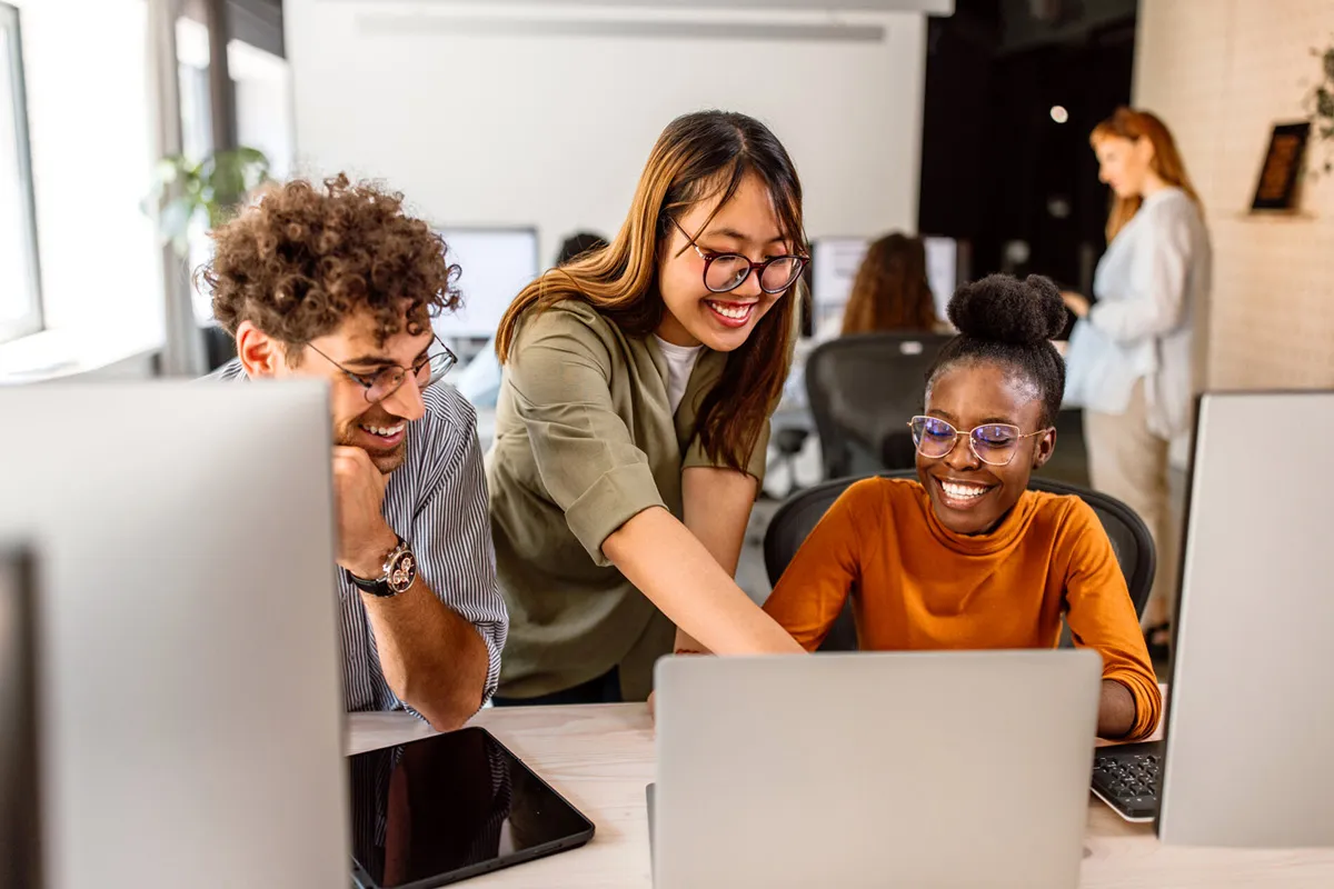 employees looking at laptop