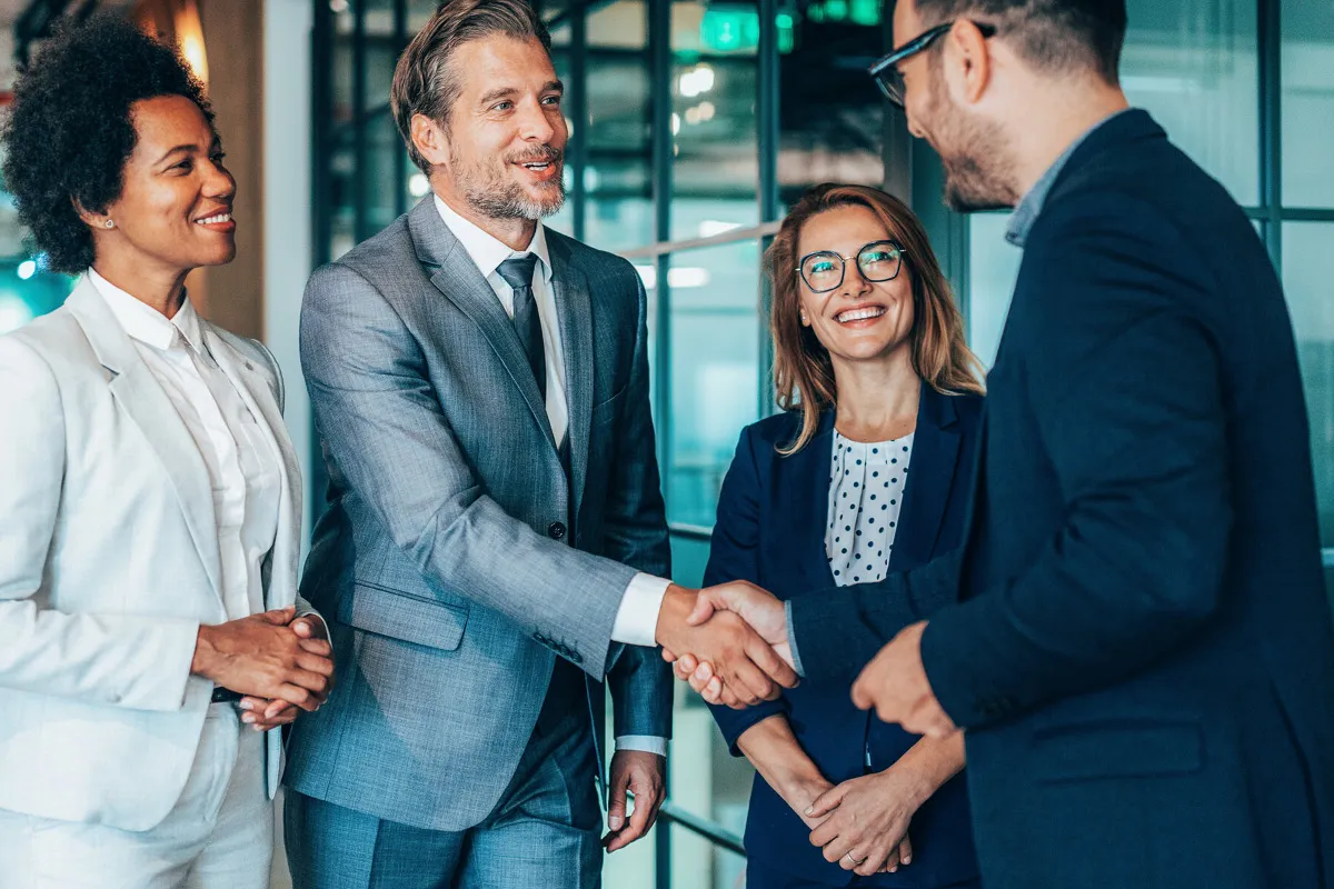 men and women having b2b growth meeting