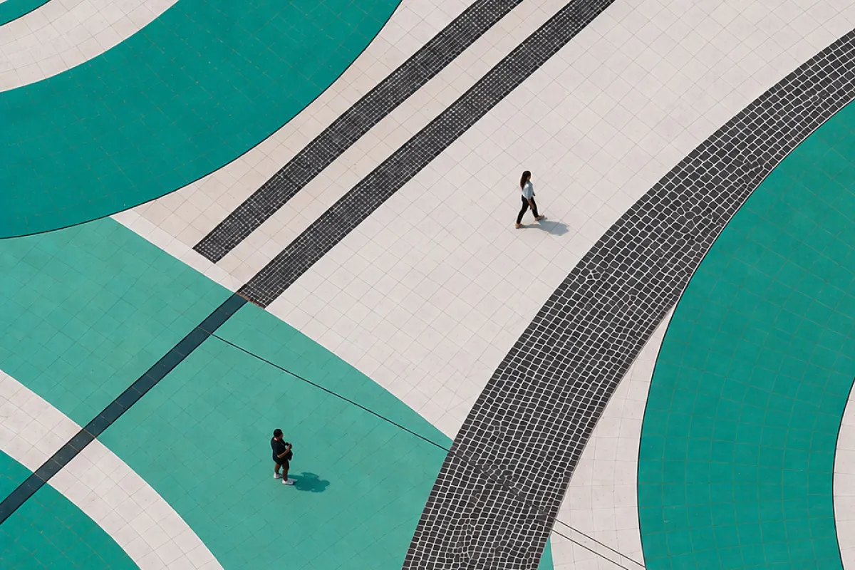 people on top of teal swirls
