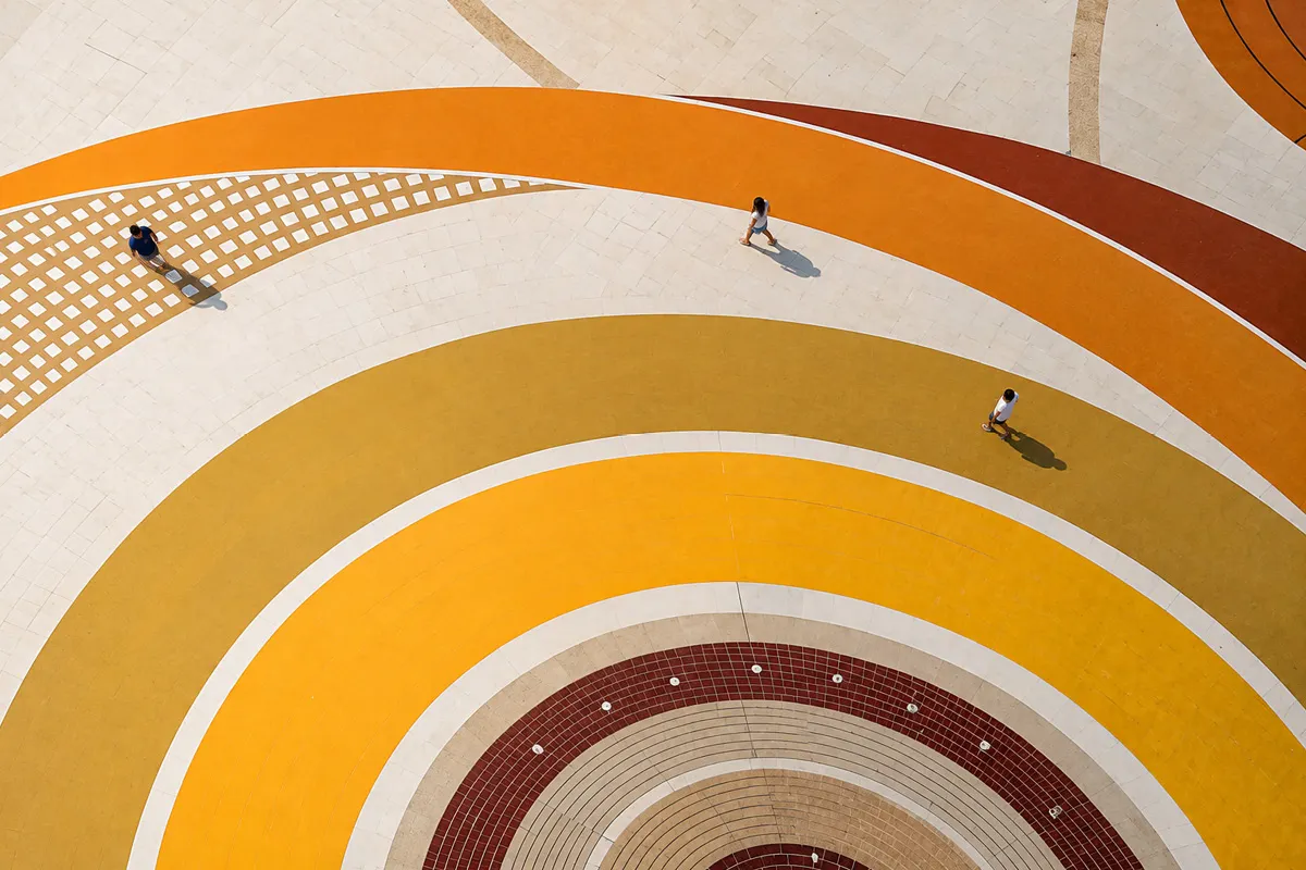 people standing on mustard colour swirls
