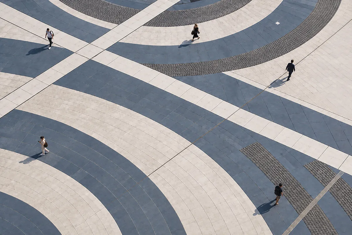 people standing on grey swirls