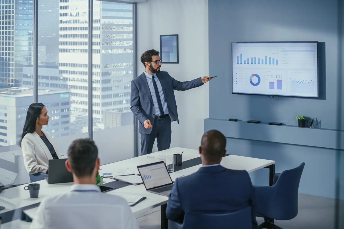 employee showing a chart with price efficiency